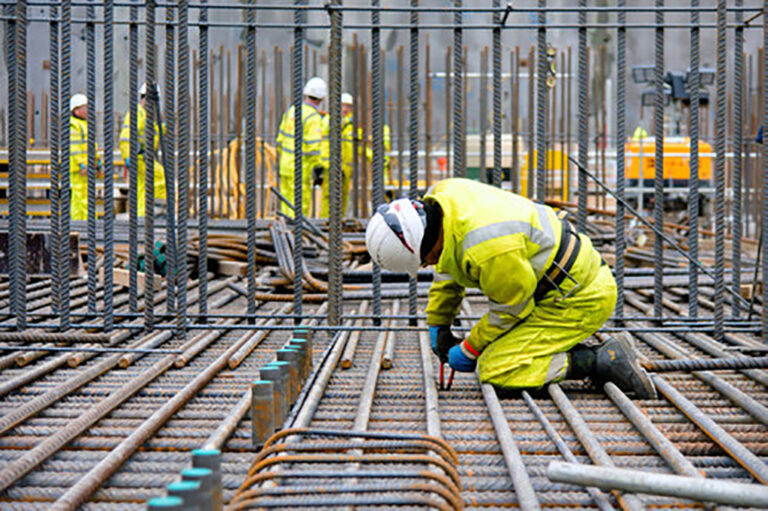 Hinkley Bylor steel fixer tying steel on Pump House Raft